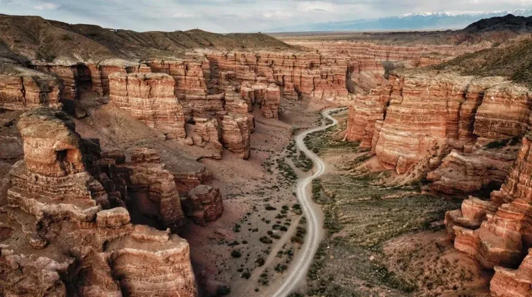 Winding trail between the red cliffs of Charyn Canyon