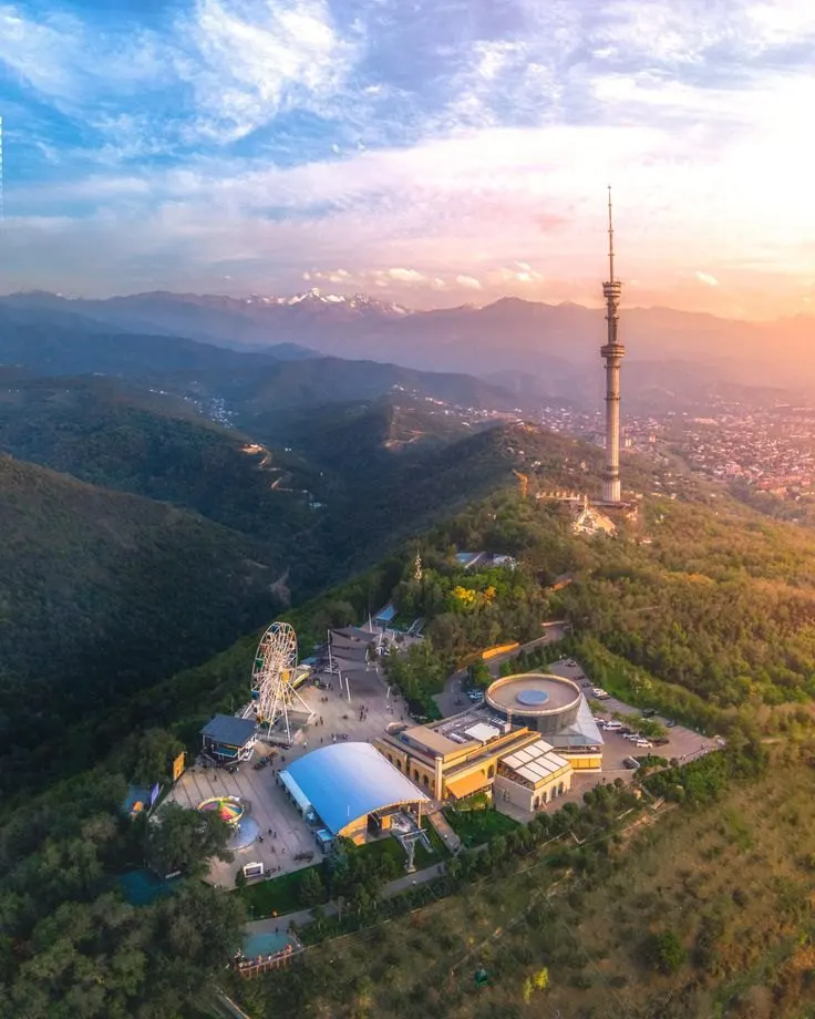 Almaty television tower and Kok-Tobe hillside at sunset
