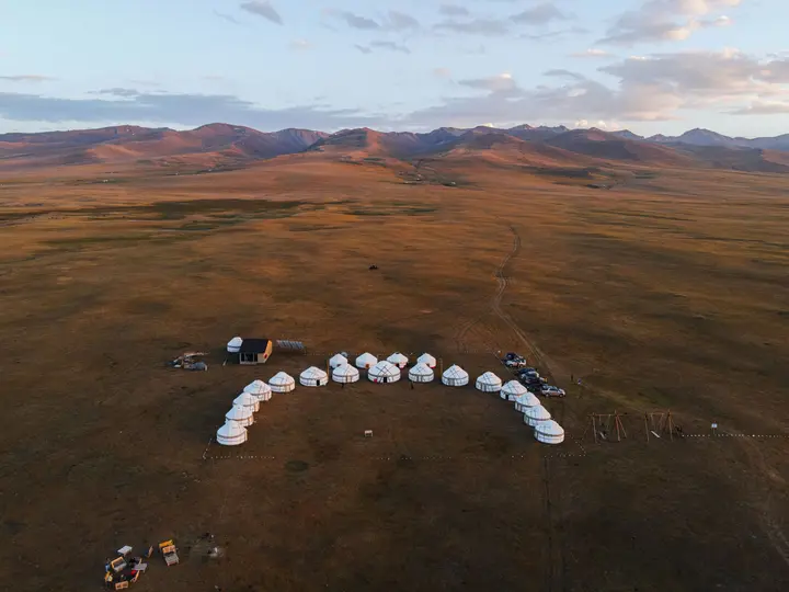 Yurt camp in the rolling hills around Song-Kol at sunset