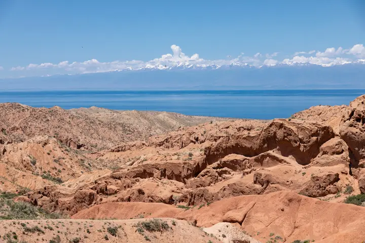 Skazka Canyon badlands beside the blue water of Issyk-Kul