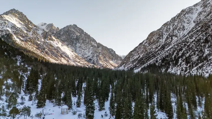 Snow-covered mountains and forest in Ala-Archa National Park