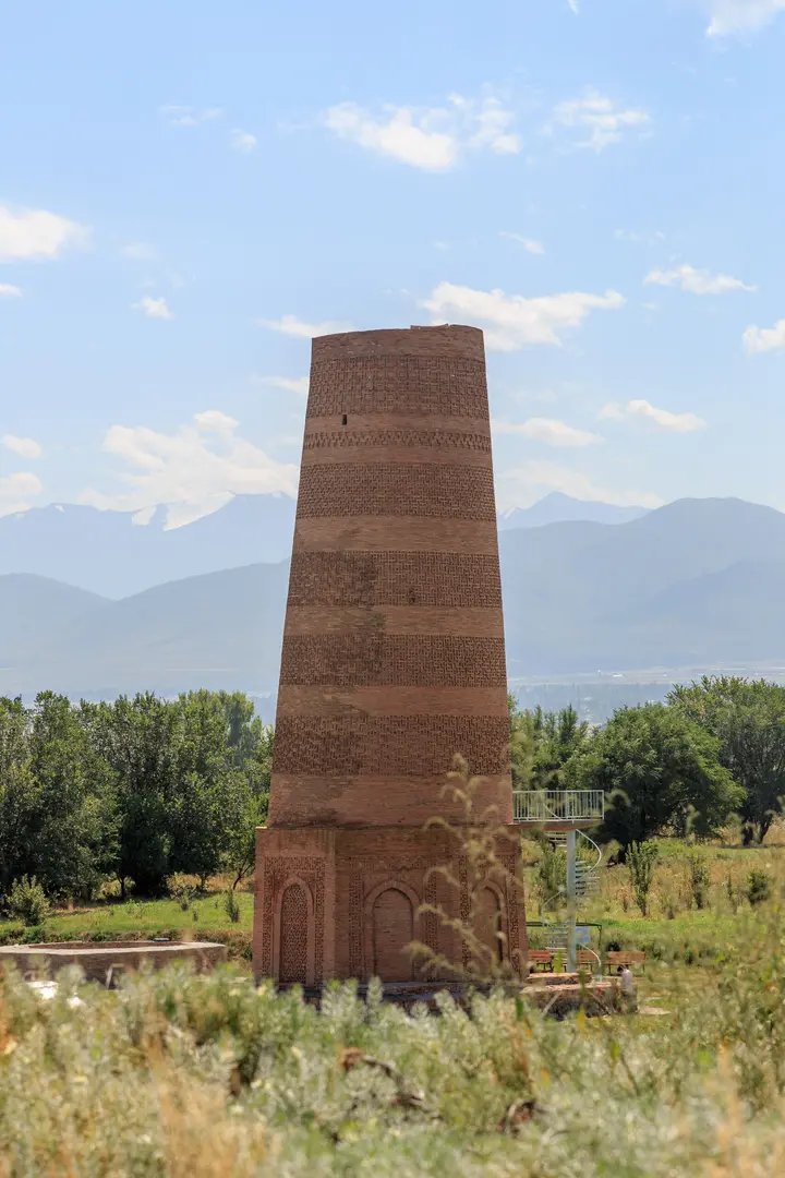 Burana Tower with the mountains of Kyrgyzstan in the background